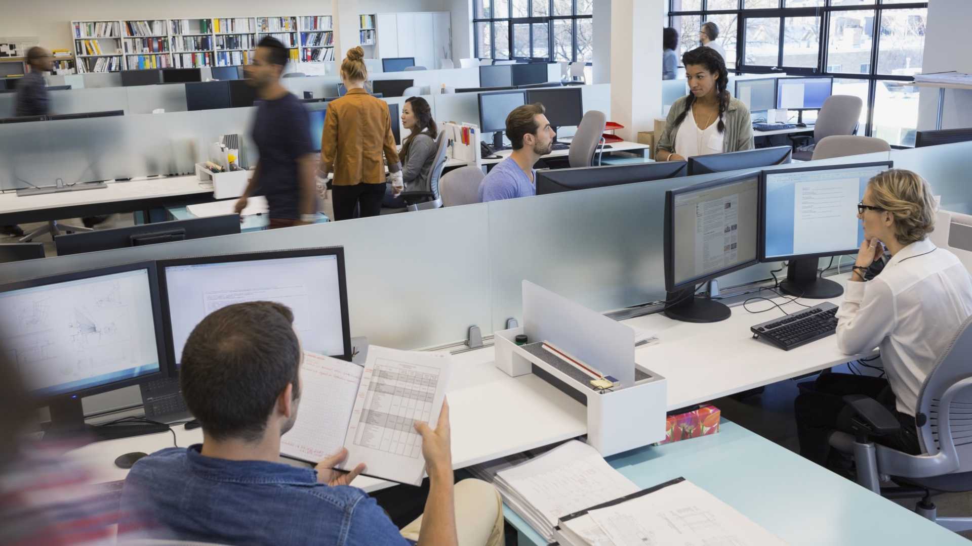 Inside an office with people working